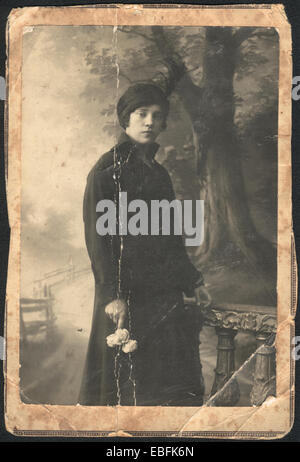 Pre-revolutionary portrait of a beautiful girl in a hat with a feather (1915 ?) Stock Photo