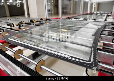Industry detail with a rear car glass on the production line in a glass factory Stock Photo