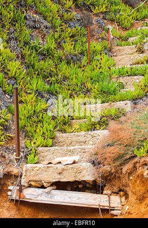 Old ruined concrete stairs at the beach in Nea Moudania, Halkidiki peninsula, Greece Stock Photo