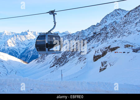 Ski lift chairs on bright winter day in Alp mountains Stock Photo