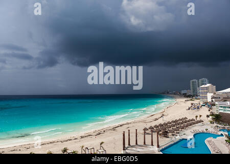 Stormy weather in Cancun, beautiful turquoise sea under dark blue clouds, view from above Stock Photo