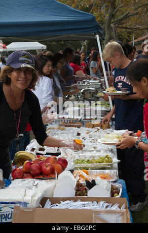 Parents and helpers serve a Picnic in a Park to high school children at the Orange County cross country championships in 2014 Stock Photo