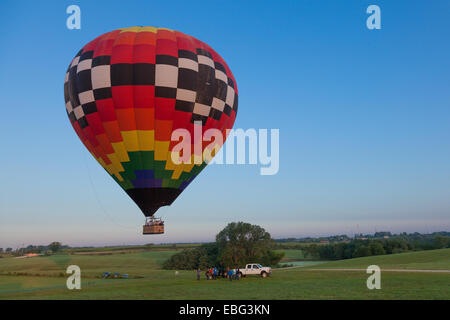 Hot air balloon lifting off with passengers. Indianola, Iowa. Stock Photo