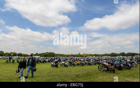 (141201) -- JOHANNESBURG, Dec. 1, 2014 (Xinhua) -- Photo taken on Nov. 30, 2014 shows the parking motorcycles at the end venue of the Toy Run in Benoni, Gauteng Province, South Africa. The annual motorcycle charity ride of South Africa, Toy Run, was held in Gauteng Province Sunday. The event, which has a 32-year history, attracted nearly 15,000 motorcyclists this year. More than 25,000 toys and stationary items have been donated by the motorcycle enthusiasts and the crowds for children. (Xinhua/Zhai Jianlan) Stock Photo