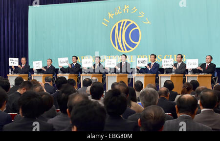 Tokyo, Japan. 1st Dec, 2014. Leaders of eight ruling and opposition parties show their mottoes during a political debate, second of such since the dissolution of the Diet's lower house, at the Japan National Press Club in Tokyo. Credit:  Aflo Co. Ltd./Alamy Live News Stock Photo