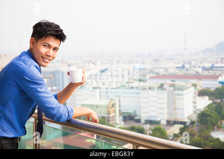 relaxed businessman watching the city view Stock Photo