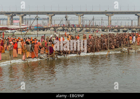 Sitting in silence as part of the initiation of new sadhus at the Sangam, the confluence of the rivers Ganges Stock Photo