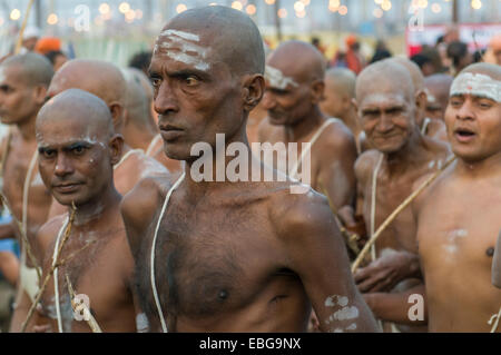 Walking back to the Akhara as part of the initiation of new sadhus, during Kumbha Mela festival, Allahabad, Uttar Pradesh, India Stock Photo