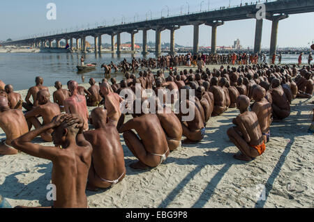 Sitting in silence at the river Ganges as part of the initiation of new sadhus, during Kumbha Mela festival, Allahabad Stock Photo