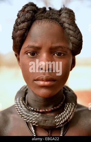 Himba girl with typical hairstyle, Omuramba, Kaokoland, Kunene, Namibia Stock Photo