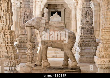 Sculpture, man riding an elephant, between ornate pillars, marble temple, temple of the Jain religion, Adinatha Temple, Ranakpur Stock Photo