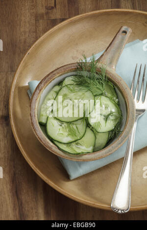 Cucumber salad with vinegar-oil dressing and dill Stock Photo