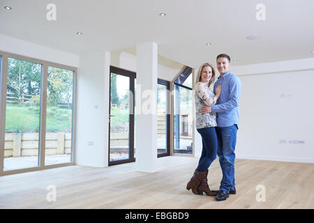Portrait Of Happy Young Couple In New Home Stock Photo