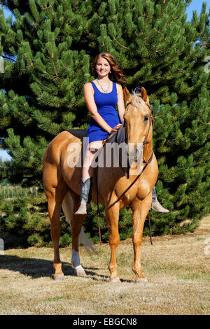 41,857.09272 Teenage girl riding her palomino horse bareback Stock Photo