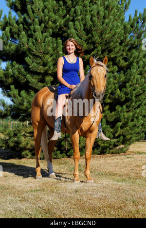 41,857.09235 Teenage girl bareback astride palomino horse Stock Photo