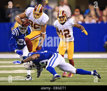 Indianapolis, IN, USA. 30th Nov, 2014. Washington Redskins tight end Jordan Reed (86) leaps over the diving tackle of Indianapolis Colts strong safety Mike Adams (29) during the second half of the NFL game between the Washington Redskins and the Indianapolis Colts at Lucas Oil Stadium in Indianapolis, Indiana. The Colts defeated the Redskins 49-27. © csm/Alamy Live News Stock Photo