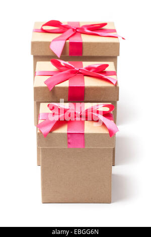 Three carton gift boxes with red ribbons isolated on white Stock Photo