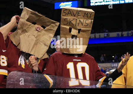 Indianapolis, IN, USA. 30th Nov, 2014. Disgruntled Redskins fans put bags over their heads at the end of the NFL game between the Washington Redskins and the Indianapolis Colts at Lucas Oil Stadium in Indianapolis, Indiana. The Colts defeated the Redskins 49-27. ©2014 Billy Hurst/CSM/Alamy Live News Stock Photo
