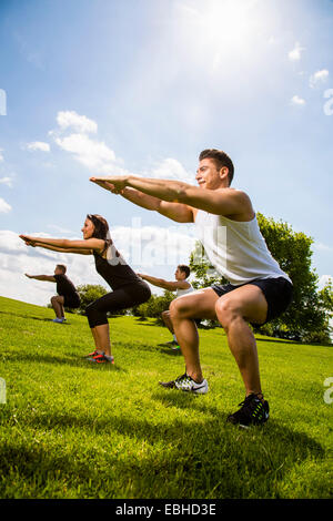 Personal trainers doing outdoor training in urban place, Munich, Bavaria, Germany Stock Photo