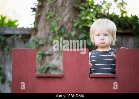 Young boy sulking Stock Photo