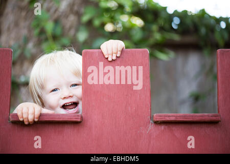 Young boy peeking Stock Photo