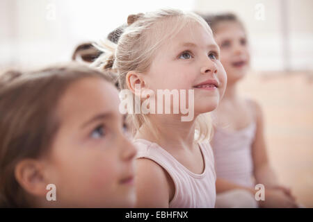Group of girls looking up in ballet school Stock Photo