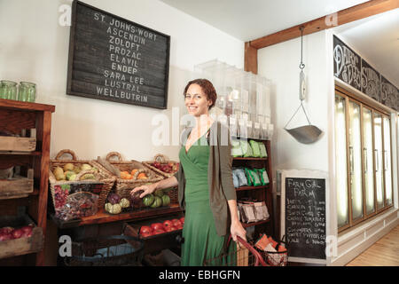 Female customer shopping in country store Stock Photo