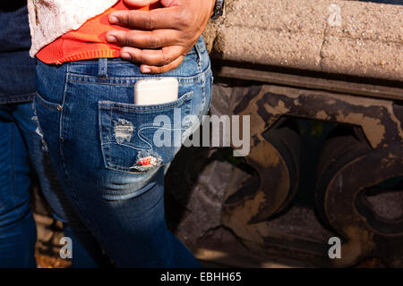 Smartphone in back pocket of jeans Stock Photo