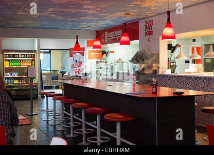 Tables / breakfast bar / counter in Little Chef fast food roadside restaurant / diner, UK. Stock Photo