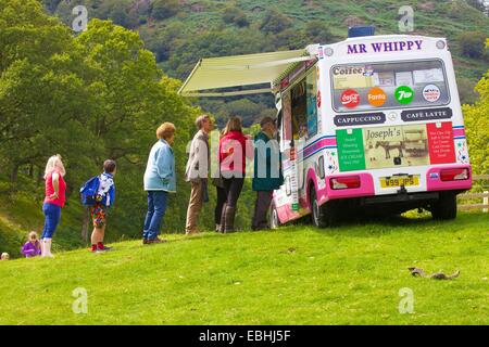 Tourists getting Ice Cream from Ice Cream Van. Rydal Show Rydal Hall Ambleside The Lake District Cumbria England UK Stock Photo