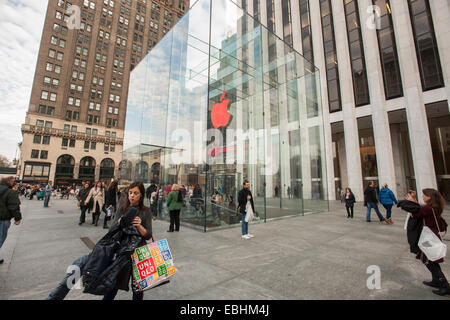 New York City, USA. 01st Dec, 2014. The Apple store on Fifth Avenue in New York displays its illuminated logo in red marking World Aids Day on Monday, December 1, 2014. A portion of the proceeds of every product sold today will go towards (RED), an organization that is in the fight against AIDS. Credit:  Richard Levine/Alamy Live News Stock Photo
