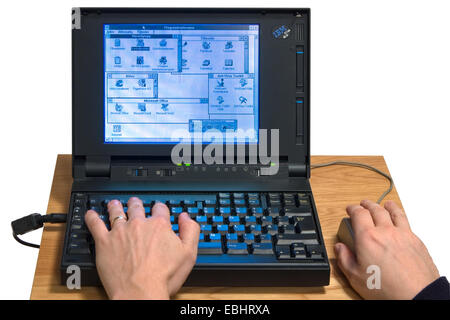 An IBM notebook from the early 1990s running Windows 3.1. Stock Photo