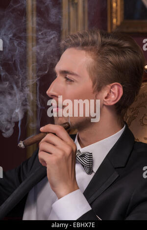 Handsome man with cigar Stock Photo