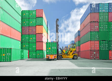 Crane lifter handling container box loading to truck Stock Photo