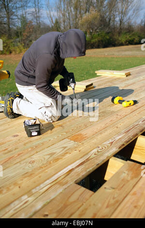 Man using a cordless drill Stock Photo