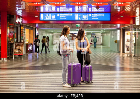 Passengers, two women tourists, at the Prague main train station Stock Photo