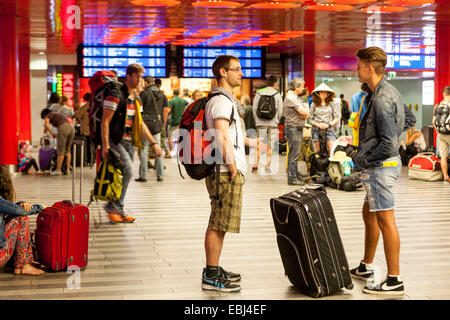 Passengers Tourists with suitcases, Prague Main Train Station Prague backpackers Czech Republic backpack Stock Photo