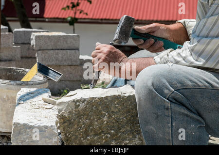 Close-up of a Stonemason at work. Photographed in Greece Stock Photo