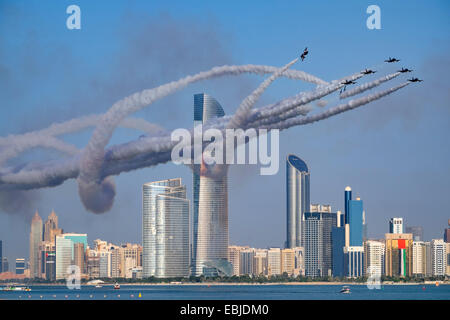 Al Fursan the aerobatics demonstration team of the United Arab Emirates Air Force display along Corniche waterfront in Abu Dhabi Stock Photo