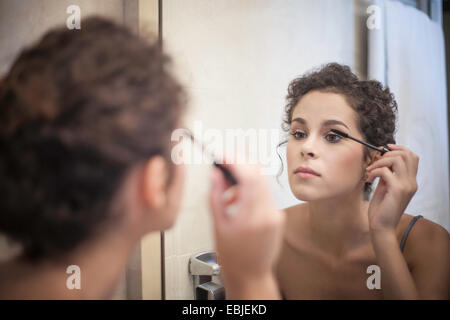Young woman applying mascara Stock Photo