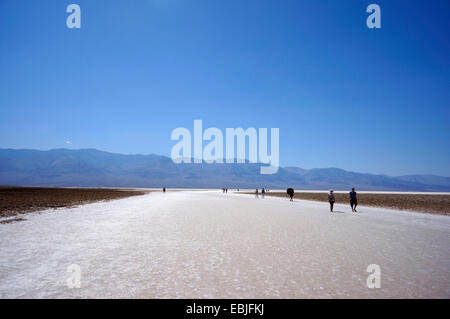 tourists walking on the salt lake, USA, California, Death-Valley-Nationalpark, Badwater Stock Photo