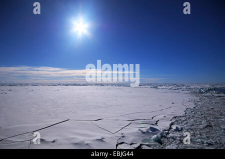 Sun over the breaking ice cover of the South Polar Ocean , Antarctica Stock Photo