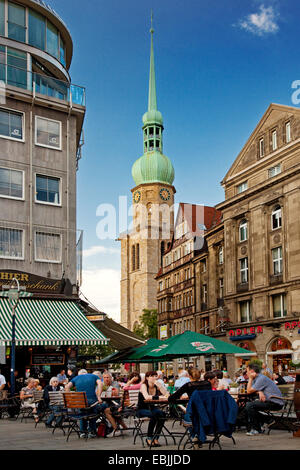 people in a street restaurant with church Reinoldikirche, Germany, North Rhine-Westphalia, Ruhr Area, Dortmund Stock Photo