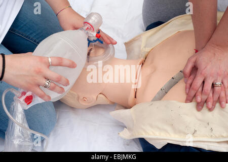 Paramedic Demonstrates Reanimation on Dummy Patient Simulated Mannequin Stock Photo