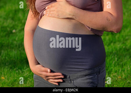 woman showing her baby bump Stock Photo