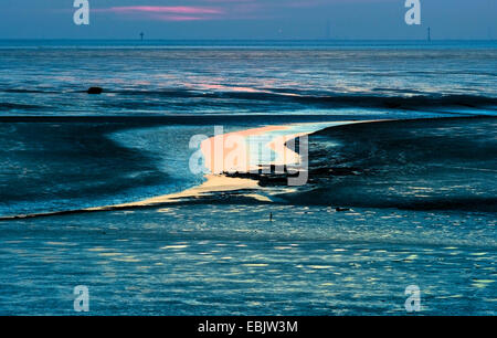 sunset in wadden sea with tideway, Germany Stock Photo