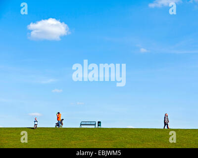 people walking on the dyke, Germany, Lower Saxony, Cuxhaven, Dorum-Neufeld Stock Photo