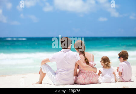 family with two children admiring the view on Caribbean beach, Mexico