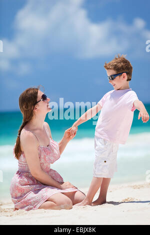 mother and son having fun at a dream beach, Mexico