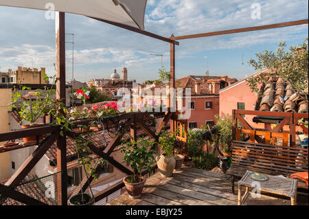 An 'altana', a traditional wooden structure used as a roof garden or terrace in Venice, Italy Stock Photo